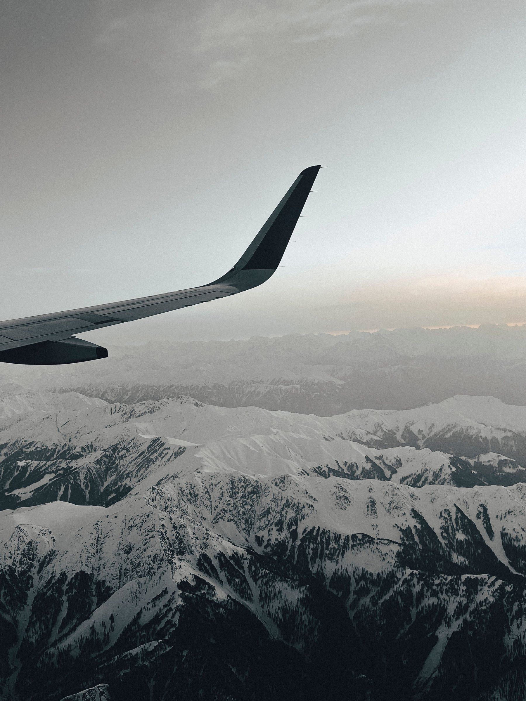 View of snowy mountains from a plane window